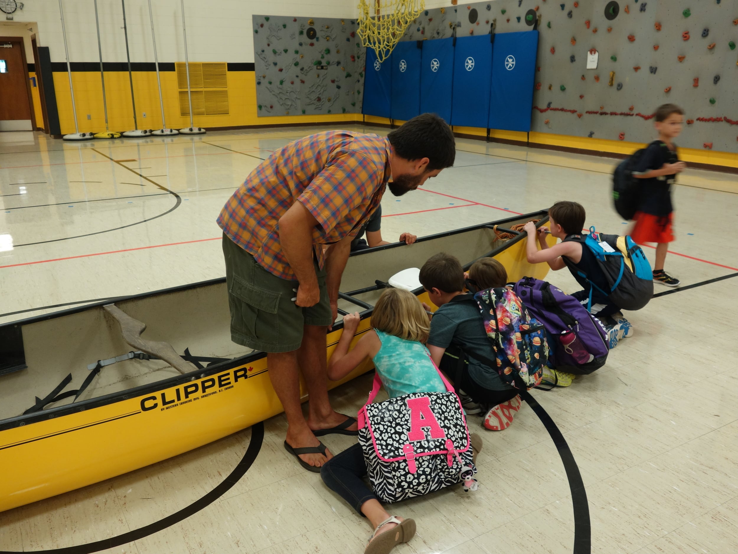 Every presentation varied a bit depending on the needs of the school. Here grades that didn't go on a field trip were able to pledge their support to the river by signing our canoe after a presentation.