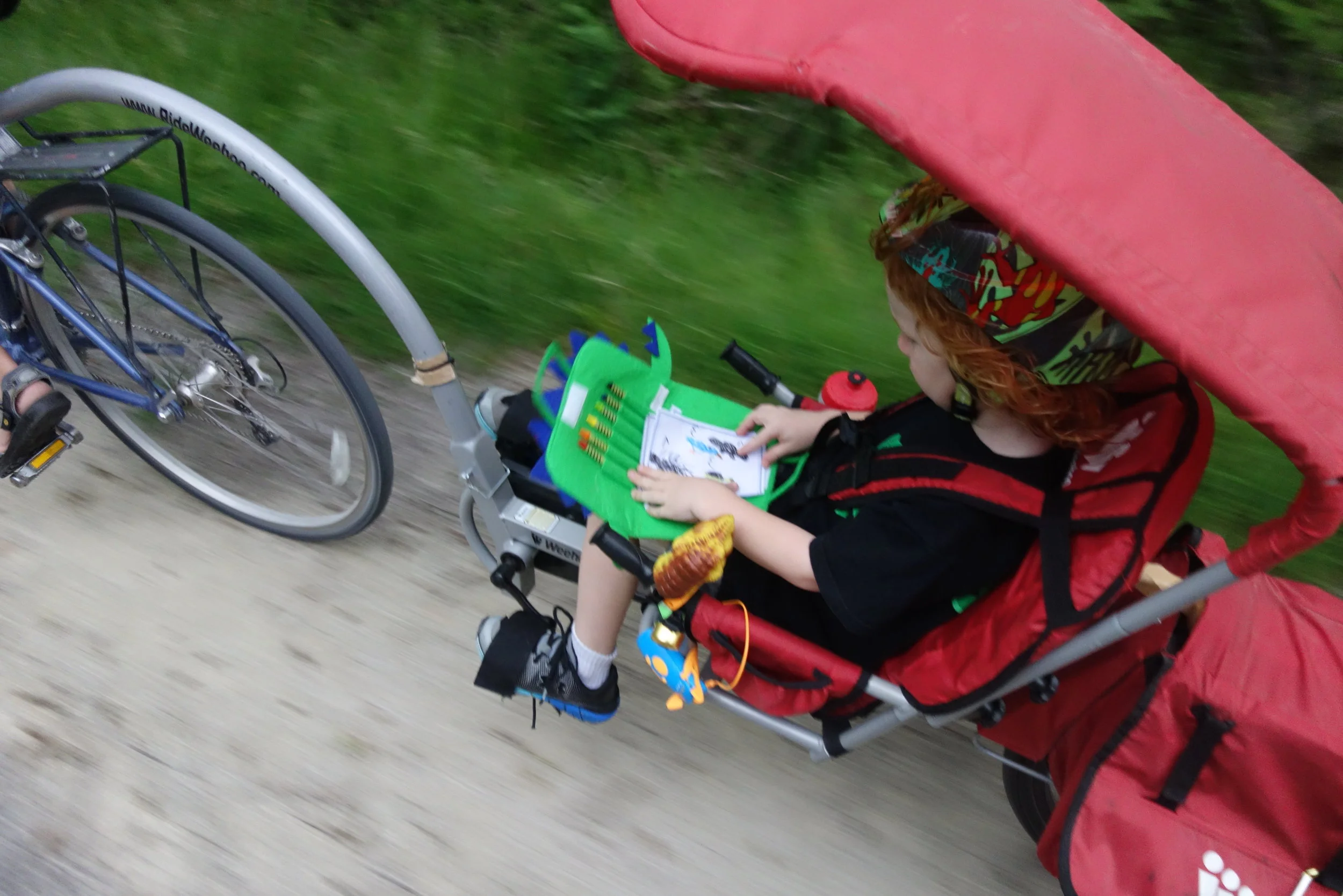Becca's son enjoying some arts and crafts while biking on the bike path.