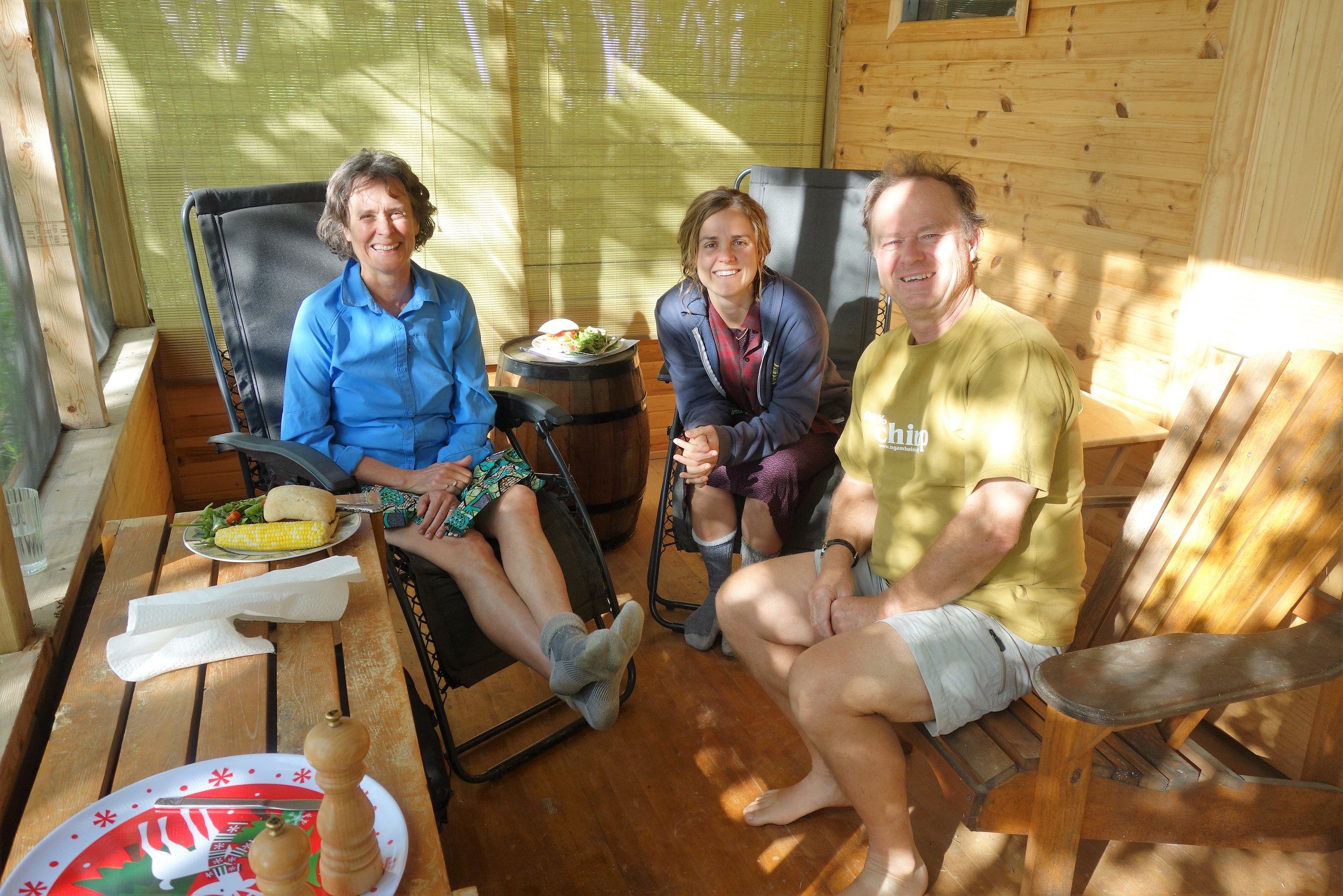Heather, Emily, and David enjoying a feast with a view.
