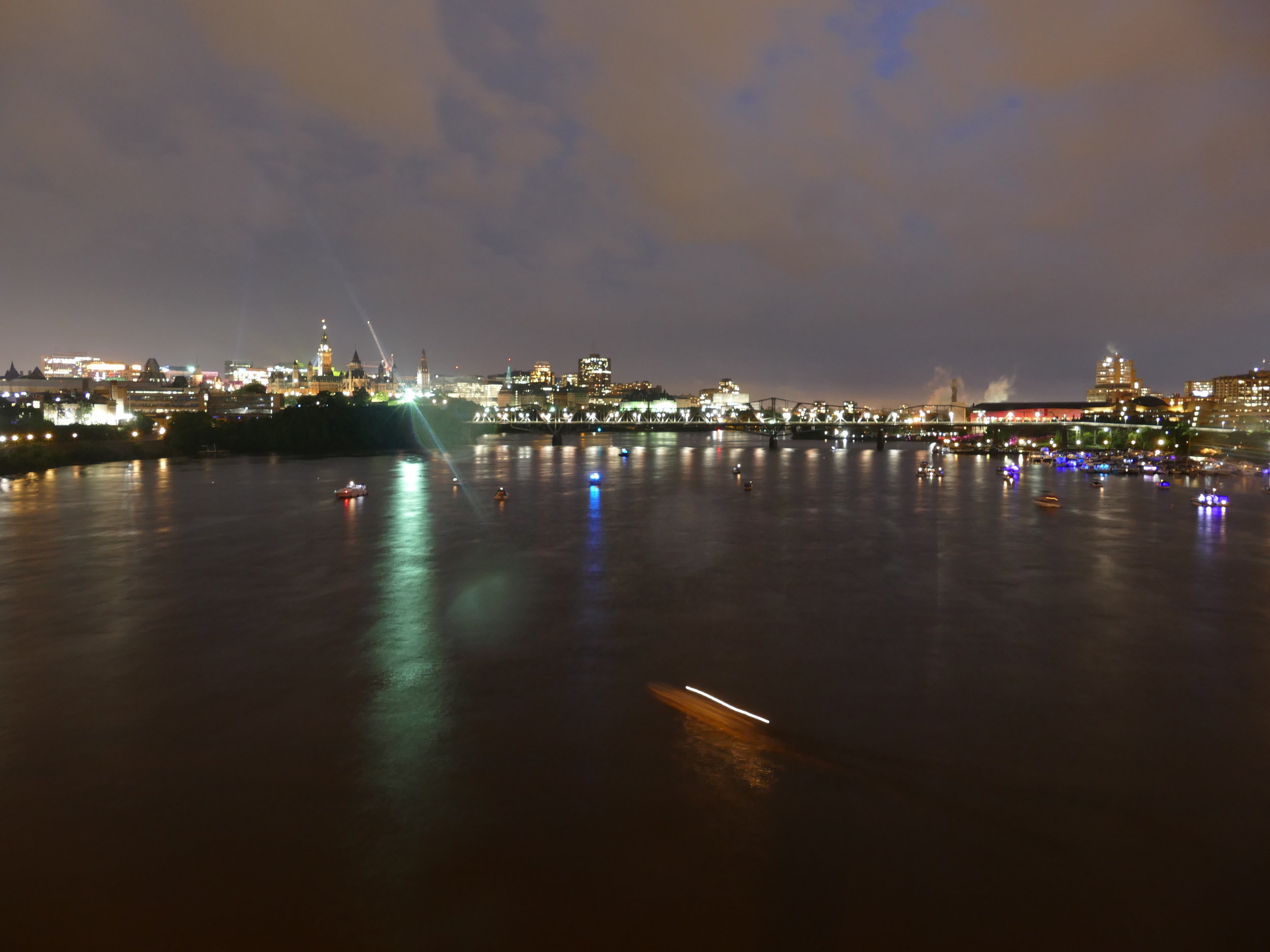 The boats started filling in the river, finding the perfect place to watch the firework show.