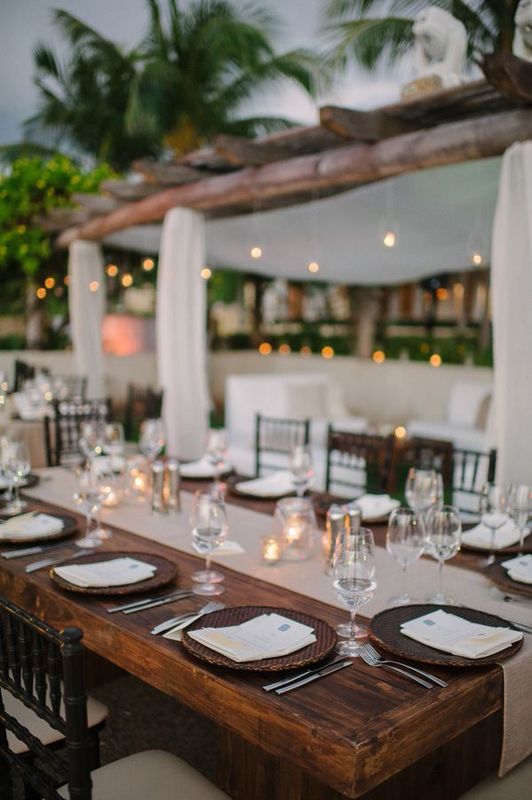 8. FROM THE SHORES OF PUNTA MITA, MEXICO: Willow chargers , a woven table runner and in the distance... hanging luminaries . Can we live here for the summer? Cool, thanks. 