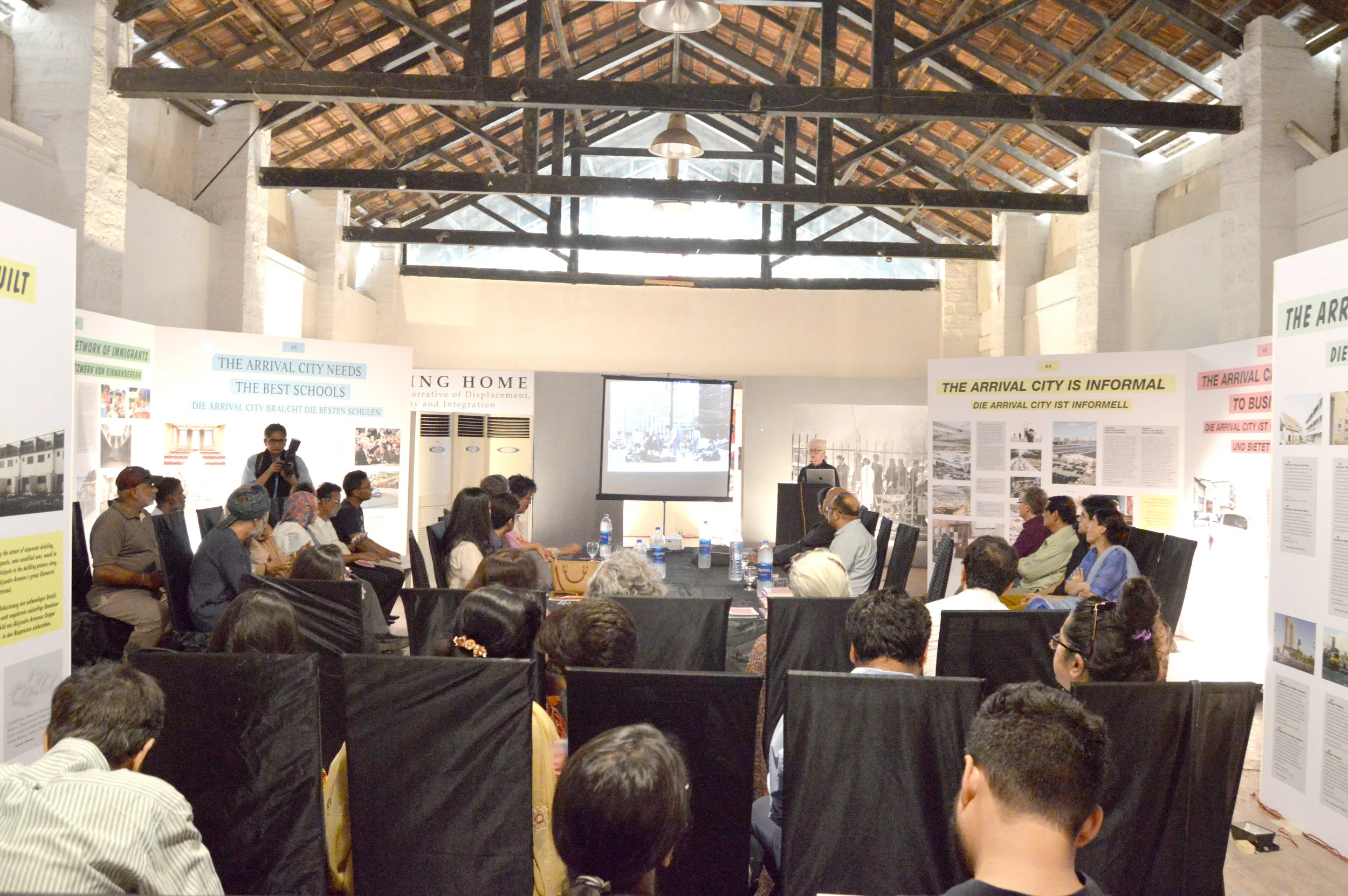 By revealing the stories of this community labelled “refugee” for four generations, a narrative emerges which is both tragic and beautiful, relatable and alien. The stories at the exhibit speak of love, of heart aches, of fears, of economics, of war, of peace, of home – of the home lost and the one gained. Article 1: https://tribune.com.pk/story/1989569/1-no-country-refugees/ Article 2: https://www.dawn.com/news/1486970 Article 3: https://www.thenews.com.pk/print/482022-a-peep-into-immigrant-phenomenon Article 4: https://epaper.dawn.com/DetailImage.php?StoryImage=23_06_2019_525_003 Article 5: http://www.artnowpakistan.com/arrival-city/ Video: https://www.facebook.com/ARTTVPAKISTAN/videos/686737425103592/ Invite: https://www.goethe.de/ins/pk/en/ver.cfm?fuseaction=events.detail&event_id=21562872