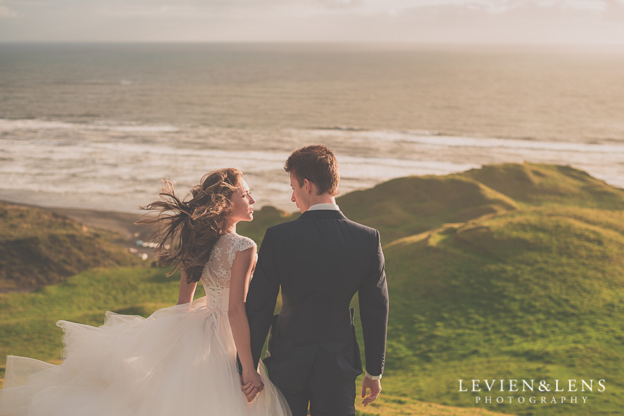 Sophisticated couple on Kariotahi beach 