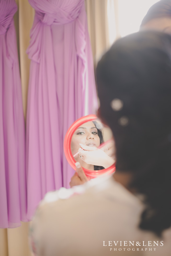 bride looking in mirror {Auckland-Waikato wedding photographer}