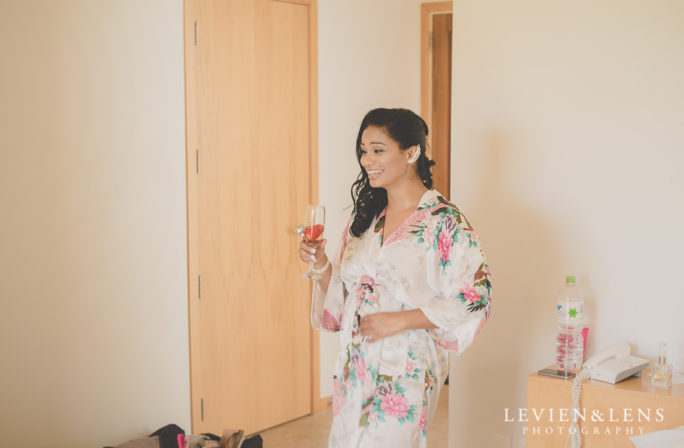 bride with glass laughing {Auckland-Waikato wedding photographer}