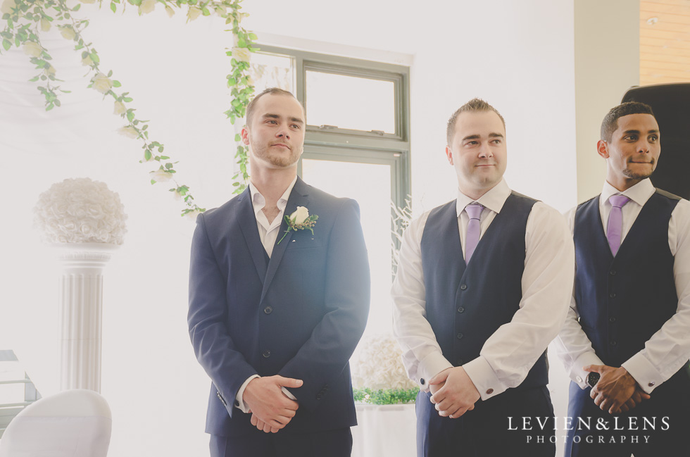 groom look at bride go down aisle {Auckland wedding photographer}