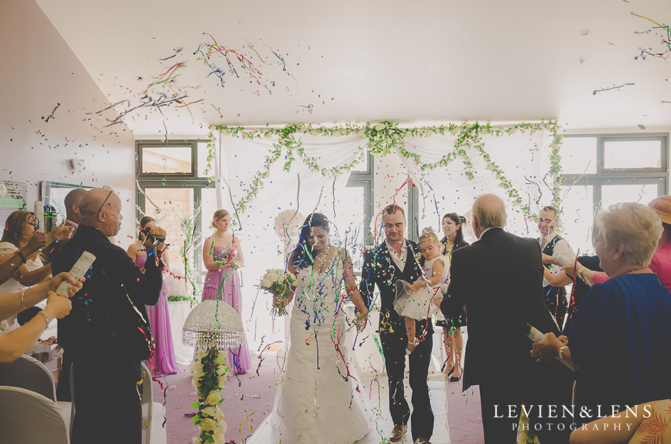 bride and groom down aisle end of wedding ceremony {New Zealand wedding photographer}