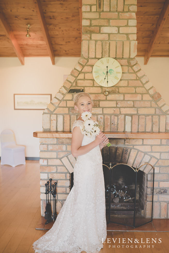 bride with flowers {Auckland-Hamilton wedding photographer} Footbridge Lodge