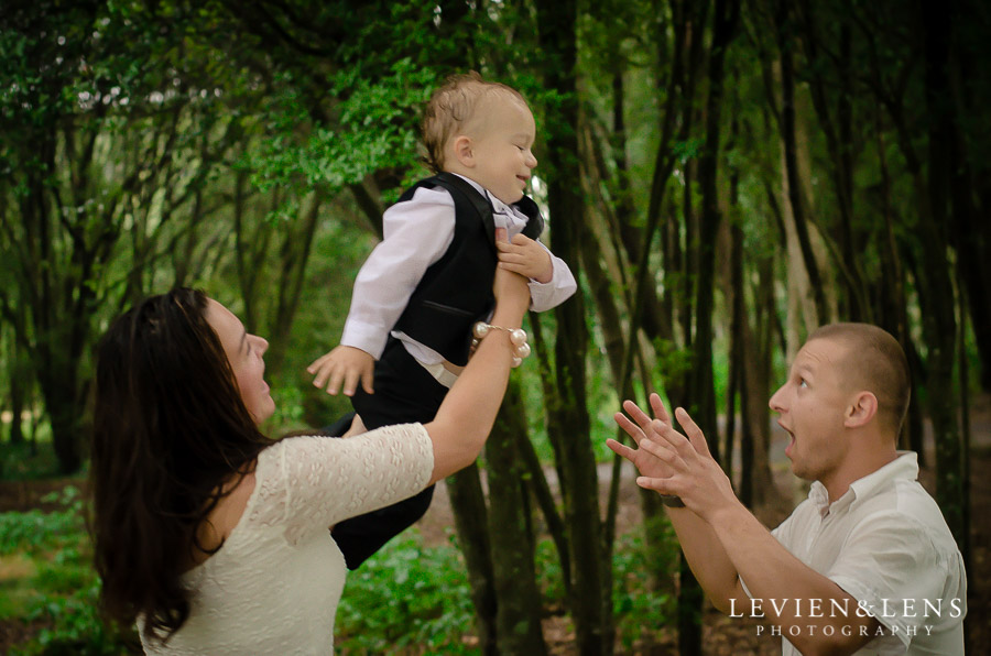 family with 1 year old kid in the air {Auckland-Hamilton lifestyle family-baby-kids photographer}