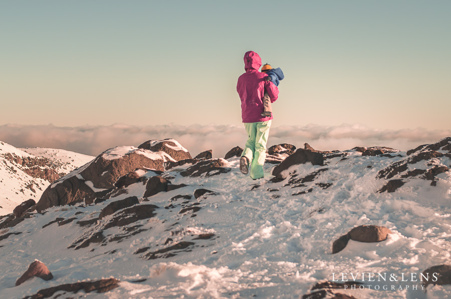 mum and baby walking in snow mountains Taupo {Auckland-Hamilton lifestyle family-baby-kids photographer}