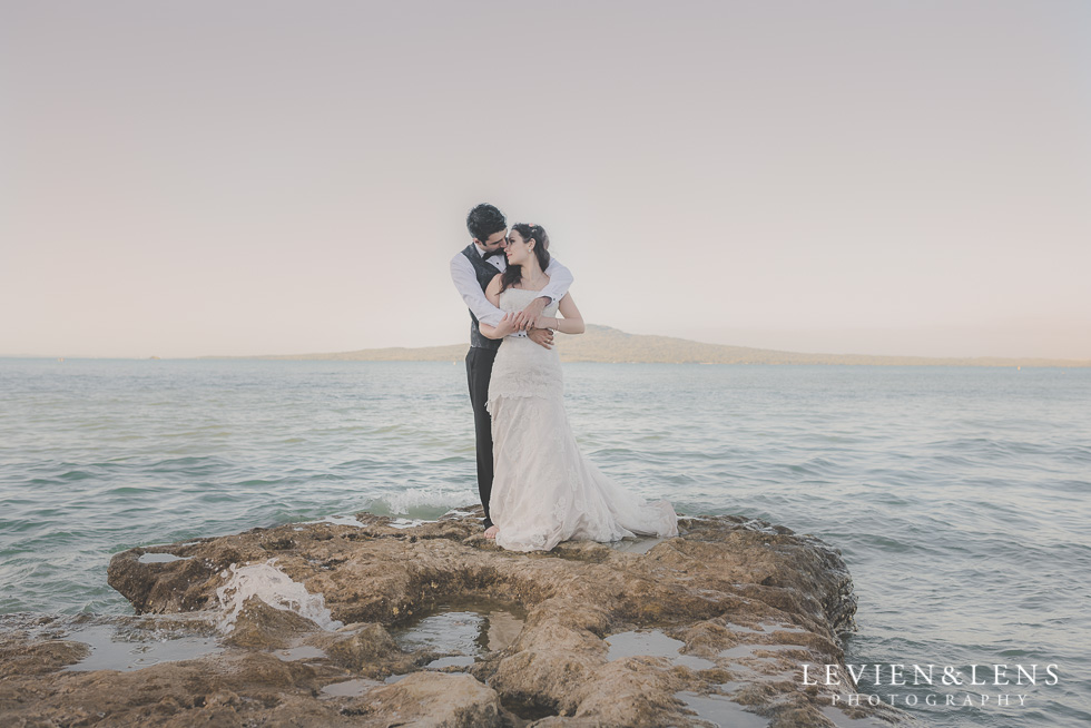 beautiful couple standing cliff St Heliers beach {Auckland-Hamilton-Tauranga wedding photographer}