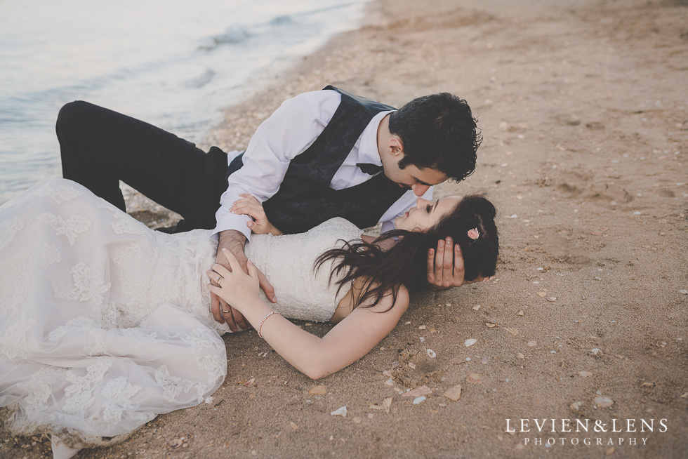 post-wedding session laying on sand St Heliers beach {Auckland-Hamilton-Tauranga wedding photographer}