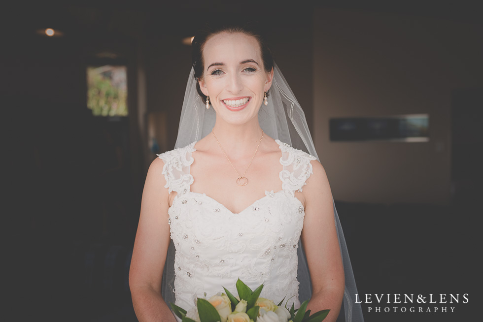 bride smile Castaways Resort - Kariotahi beach wedding {Auckland lifestyle couples-engagement photographer}