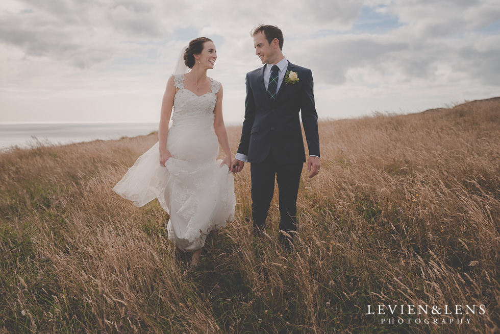 bride groom walking - location shoot Kariotahi beach Castaways {Auckland wedding-engagement-couples photographer}