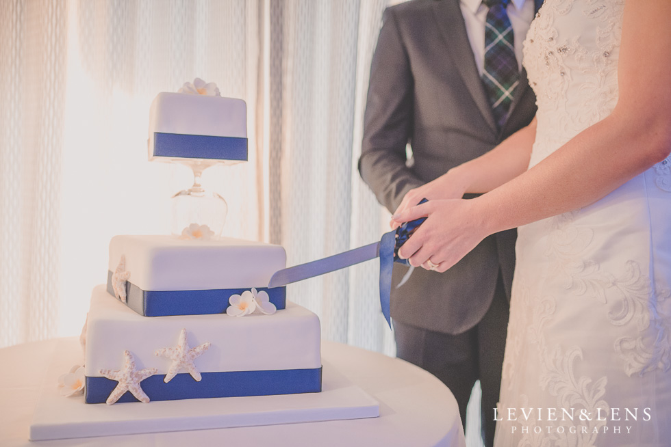 cake cutting reception Castaways {Auckland wedding-engagement-couples photographer}