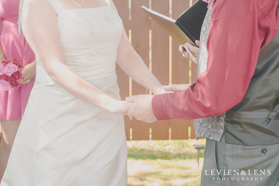 bride and groom holding hands small family garden wedding ceremony {Auckland lifestyle couples-engagement photographer}