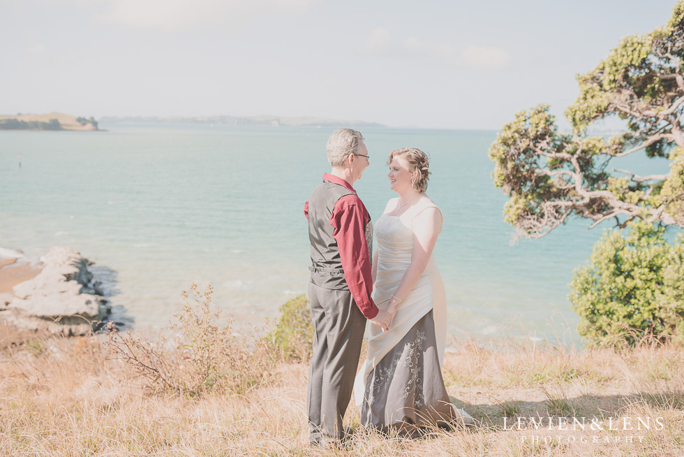 couple standing at costal side Musick Point {Auckland lifestyle wedding-engagement photographer}