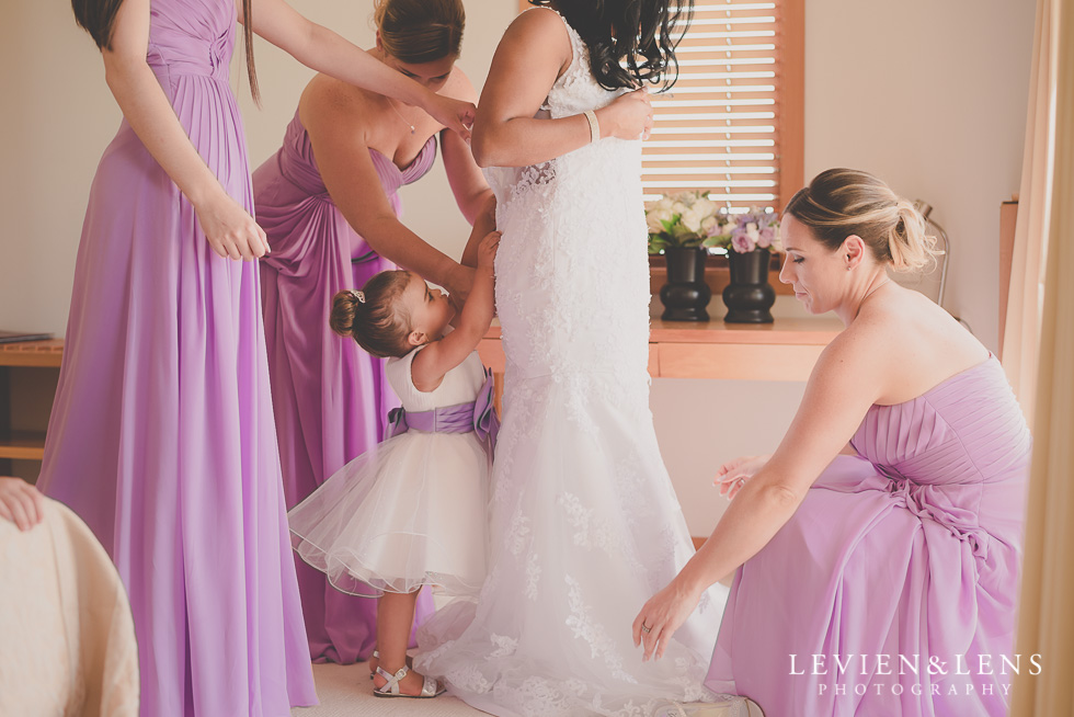 bride putting dress on {Auckland-Hamilton-Tauranga lifestyle wedding-couples-engagement photographer}