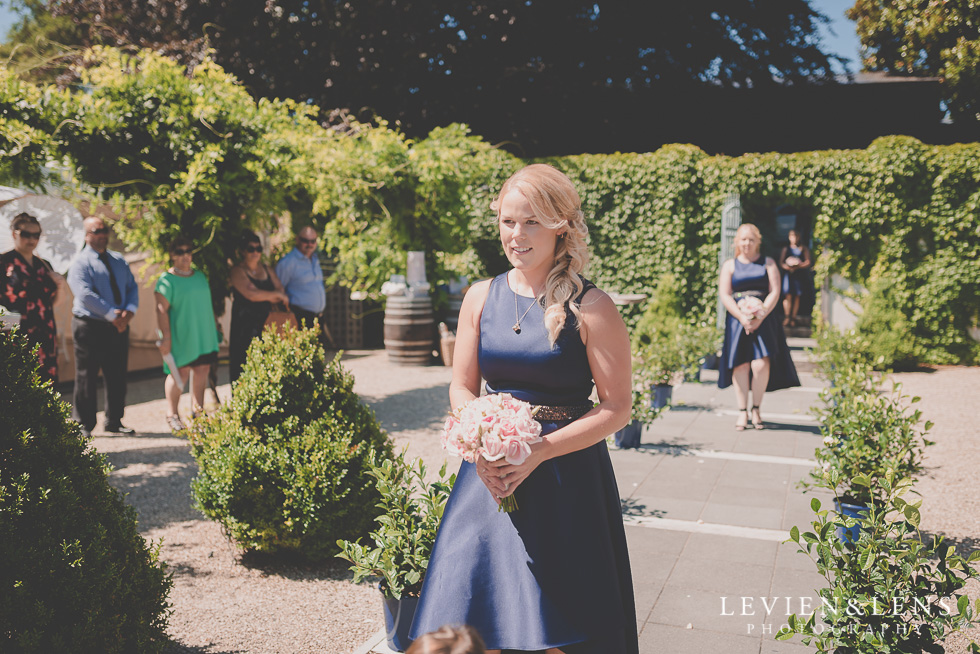 bridesmaids walking down aisle {Tauranga-Bay of Plenty wedding-couples-engagement photographer}