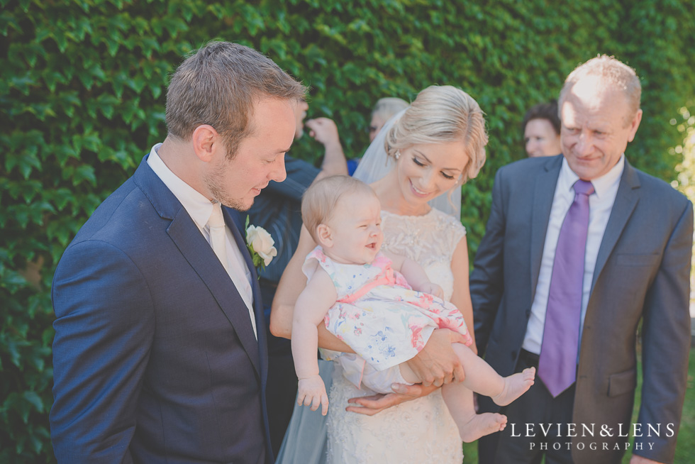 bride holding baby {Tauranga-Bay of Plenty wedding-couples-engagement photographer}