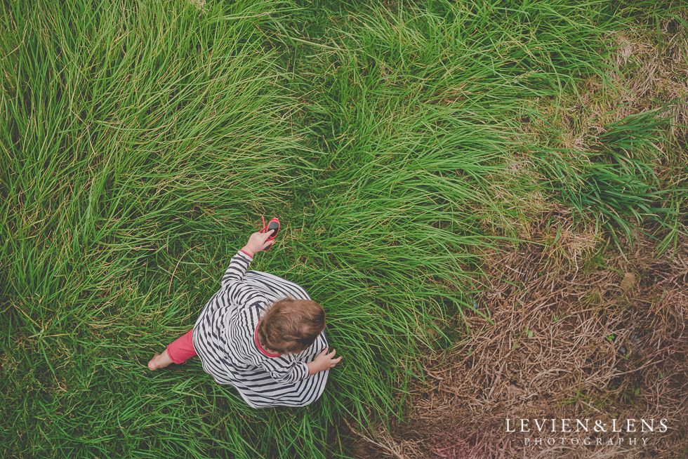 girl in grass North Head {Auckland lifestyle wedding photographer}