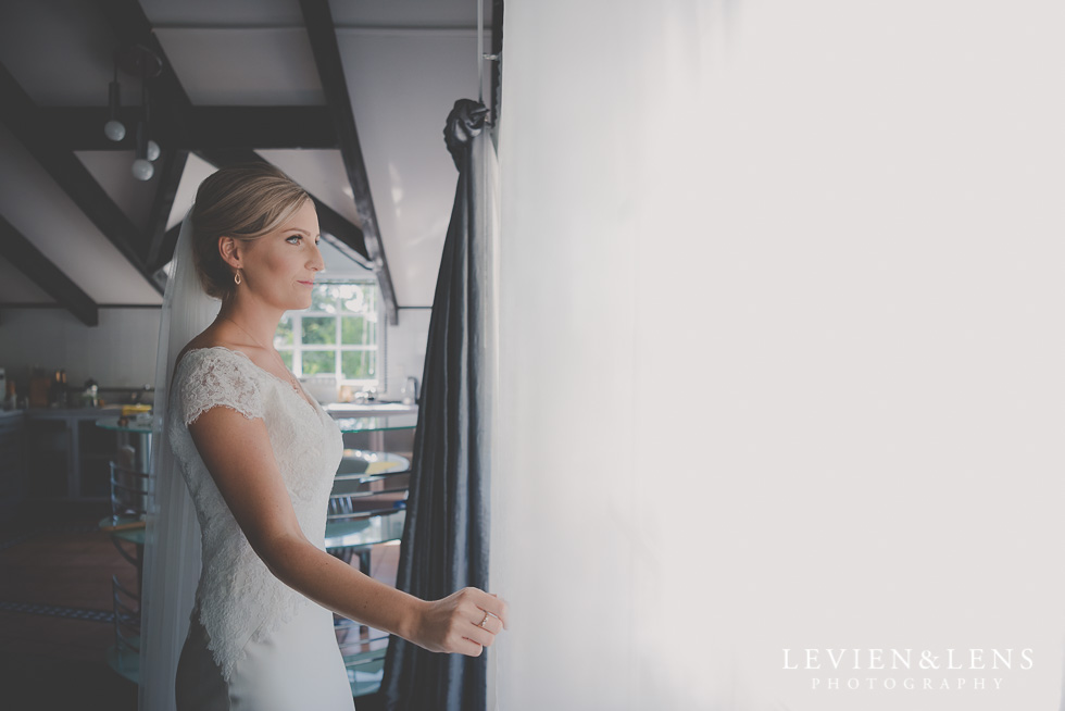 bride near window bride getting ready Kaurilands Estate {Auckland wedding photographer}