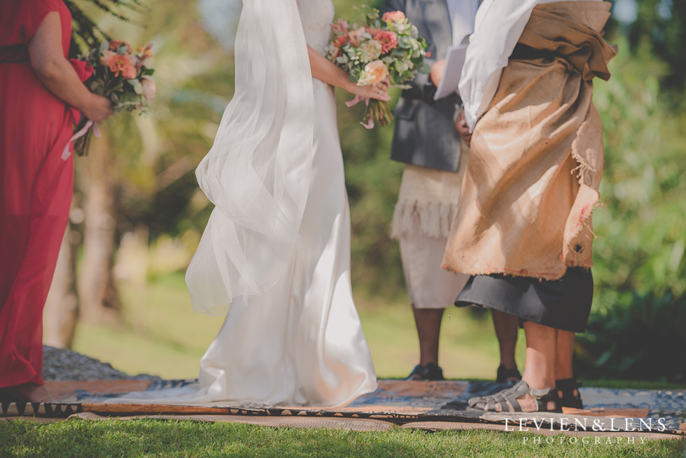 bride and groom on ceremony Landscendt Tropical Garden {Auckland lifestyle wedding photographer}