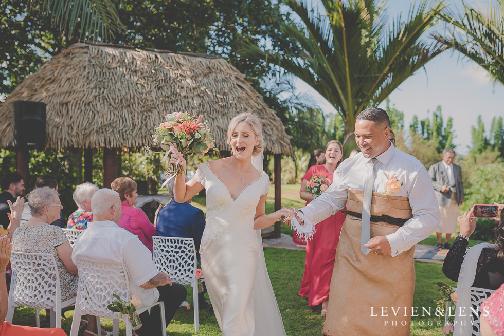 bride and groom walking down aisle Landscendt Tropical Garden {Auckland lifestyle wedding photographer}