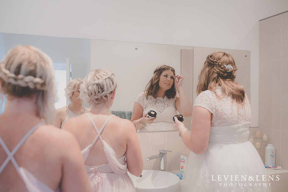 bride with bridesmaids getting ready {Northland-Auckland-Waikato wedding photographer}