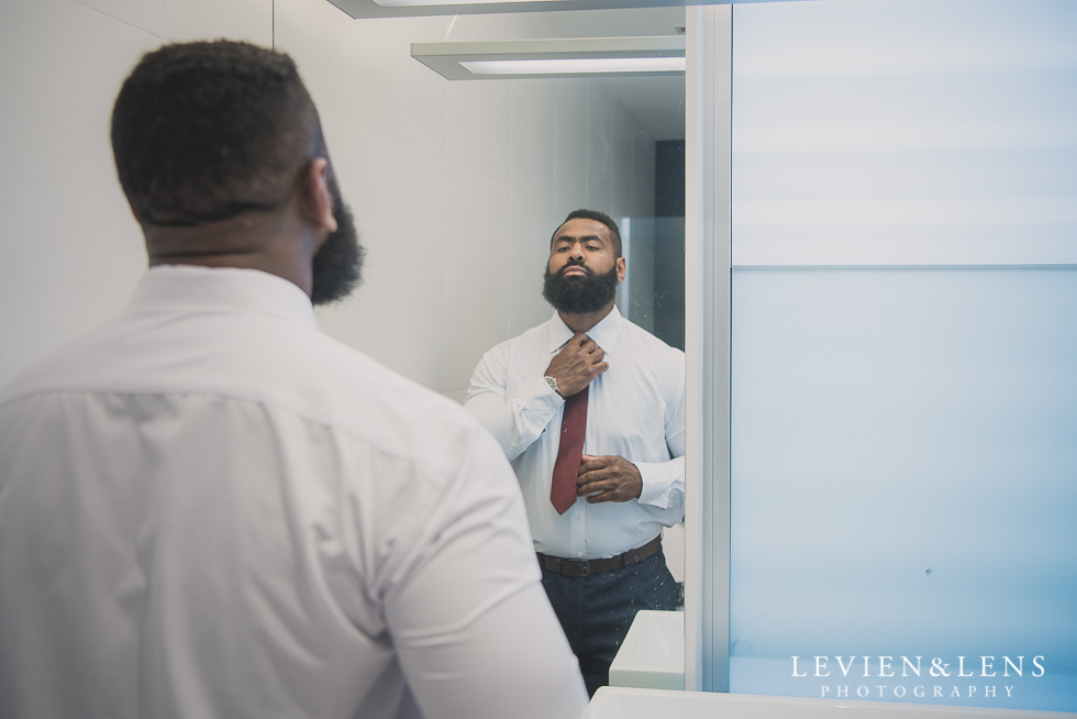 groom getting ready Brigham - Herald Island {Auckland lifestyle wedding photographer}