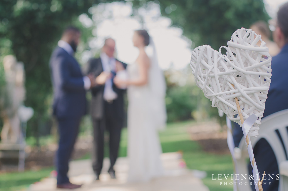 bride and groom exchange vows Brigham - Herald Island {Auckland lifestyle wedding photographer}