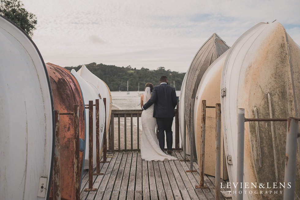bride and groom near boats Brigham - Herald Island {Auckland lifestyle wedding photographer}