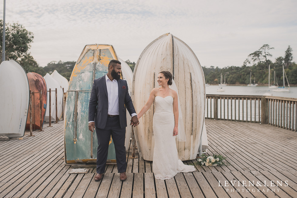 bride groom in front boats Brigham - Herald Island {Auckland lifestyle wedding photographer}