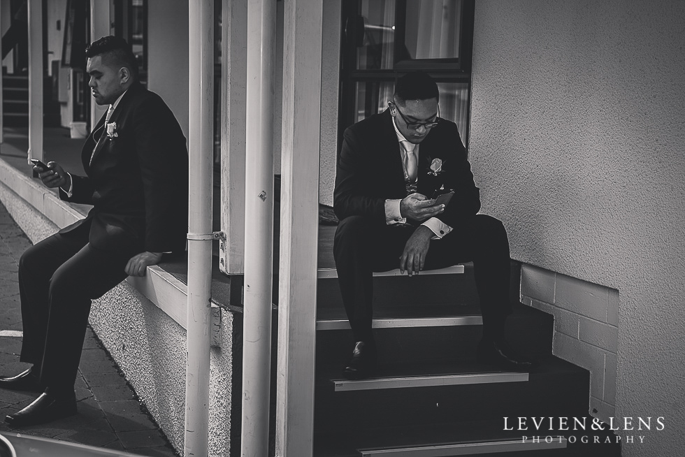 groomsmen sitting on stairs Church Of The Holy Sepulchre - Bastion Point {Auckland NZ lifestyle wedding-engagement photographer}