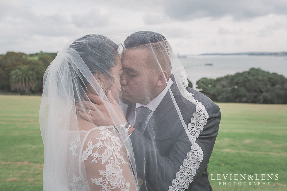 bride and groom under veil Church Of The Holy Sepulchre - Bastion Point {Auckland NZ lifestyle wedding-engagement photographer}