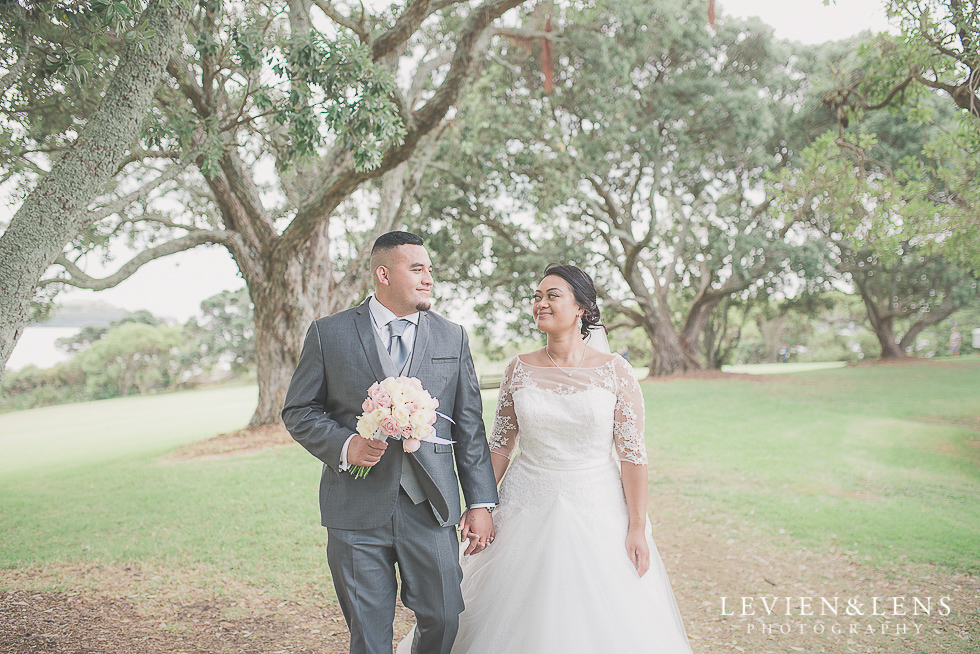 bride and groom walking at park Church Of The Holy Sepulchre - Bastion Point {Auckland NZ lifestyle wedding-engagement photographer}