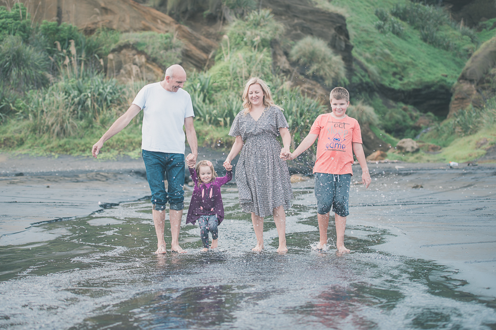family holding hands Kariotahi beach photo shoot {Auckland lifestyle family-kids photographer}