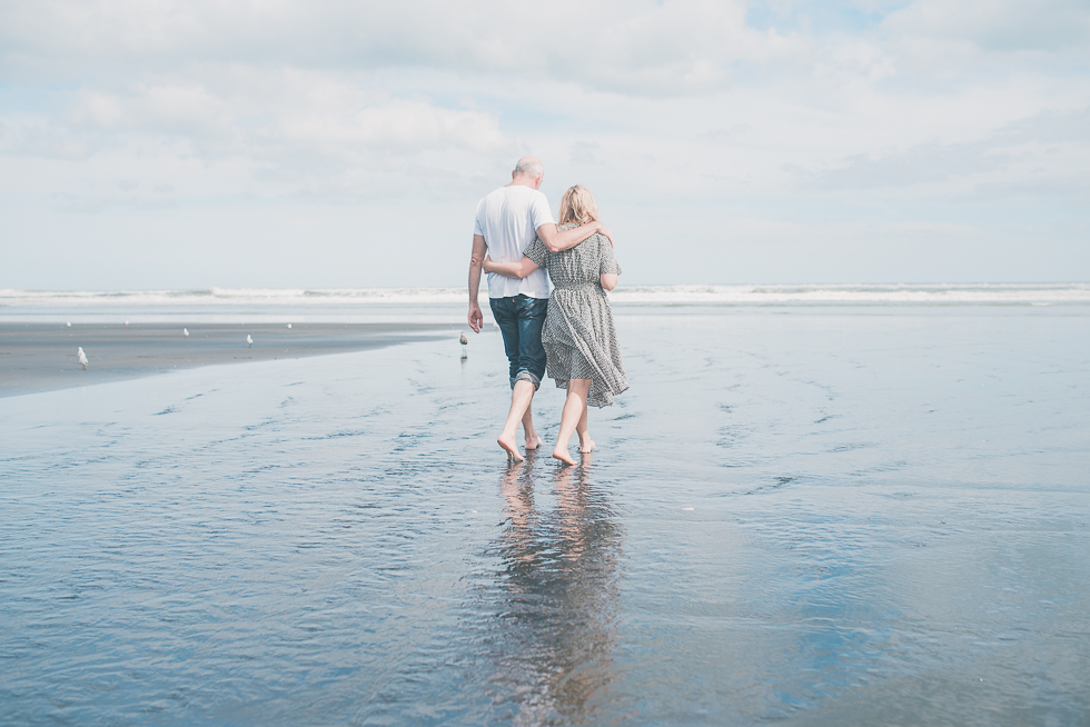 mum and dad walking - Kariotahi beach photo shoot {Auckland lifestyle family-kids photographer}