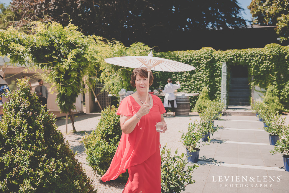 mother at ceremony with umbrella Mothers on wedding - Mother's Day feature {New Zealand lifestyle couples-engagement photographer}