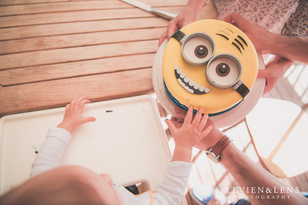 baby and cake Butterfly Creek Minions birthday party {Auckland NZ event photographer} Nazar 1 year old
