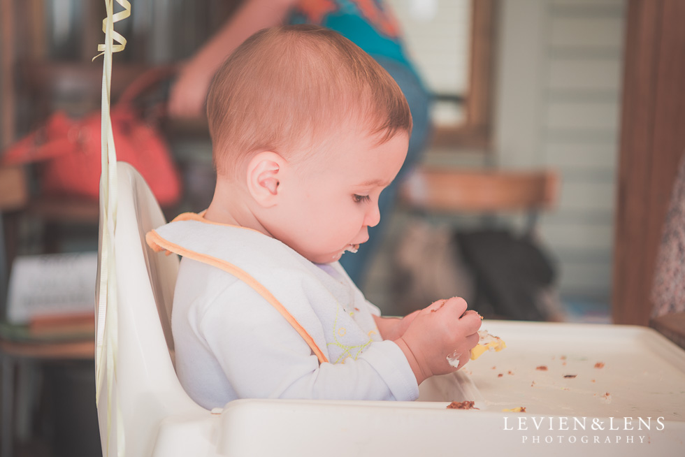 baby in high chair Butterfly Creek Minions birthday party {Auckland NZ event photographer} Nazar 1 year old