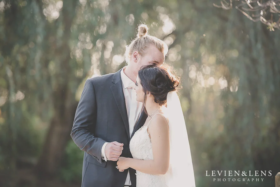 bride and groom intimate moment at signing register St Margarets Cafe - Karaka {Auckland lifestyle wedding photographer}