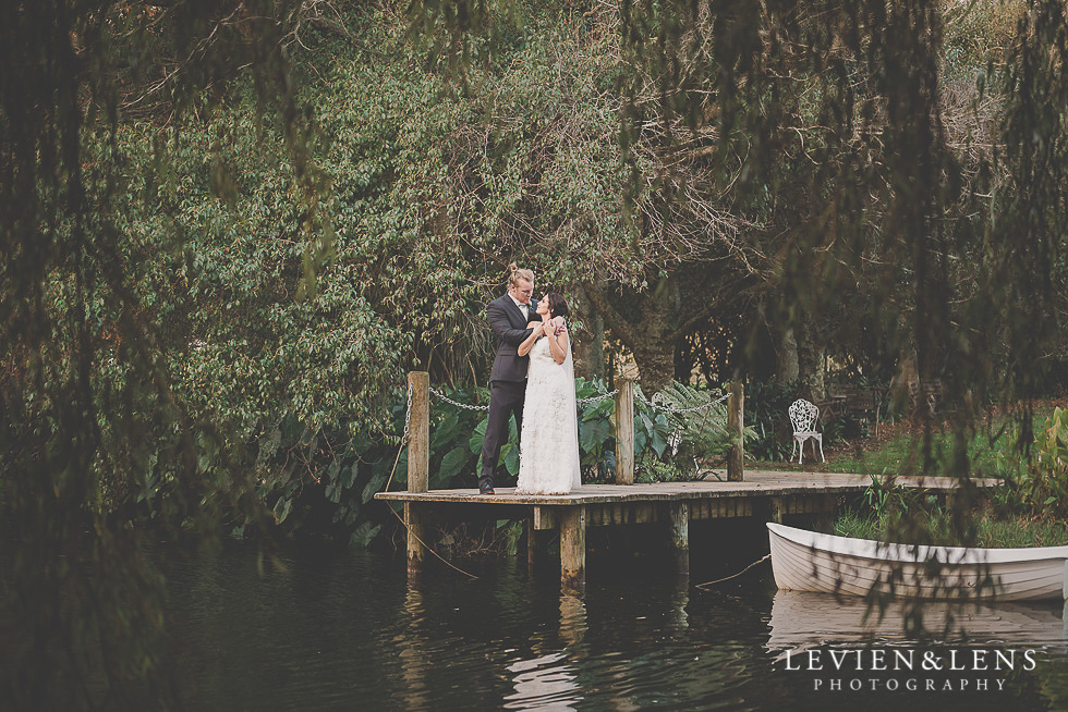 bride and groom near lake St Margarets Cafe - Karaka {Auckland lifestyle wedding photographer}