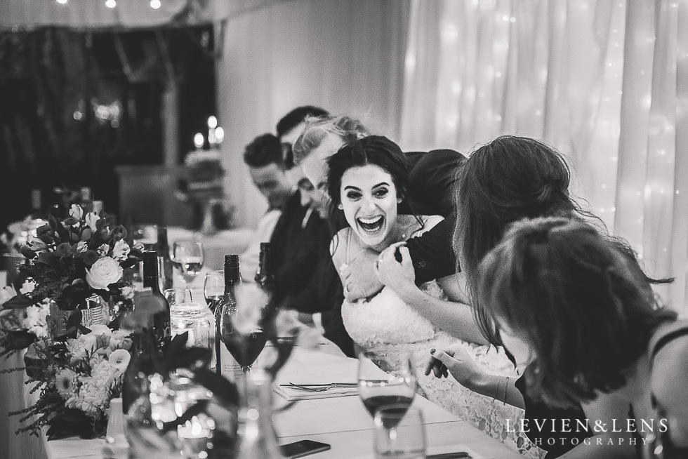 bride and groom laughing - reception St Margarets Cafe - Karaka {Auckland lifestyle wedding photographer}