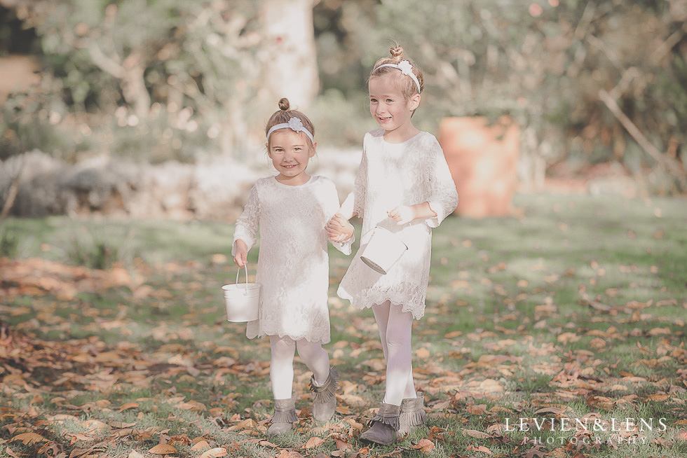 flower girls walking down aisle St Margarets Cafe - Karaka {Auckland lifestyle wedding photographer}