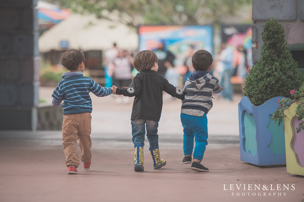 three boys holding hands - Rainbows End birthday party {Auckland lifestyle event-family-kids photographer}