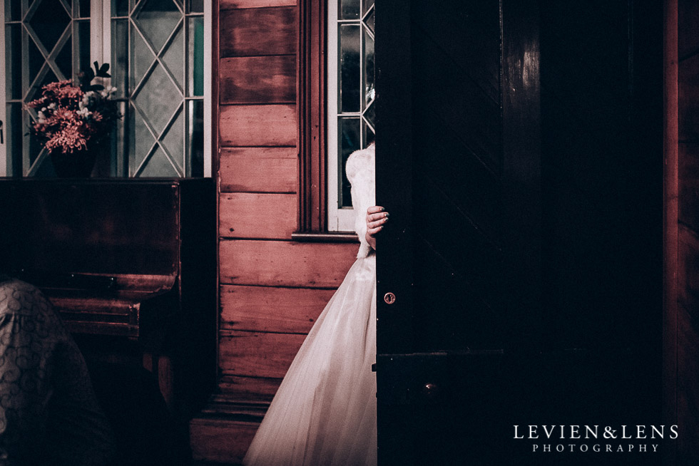 bride at reception walking in door - Highwic historic house-museum winter wedding {Auckland NZ lifestyle weddings photographer}