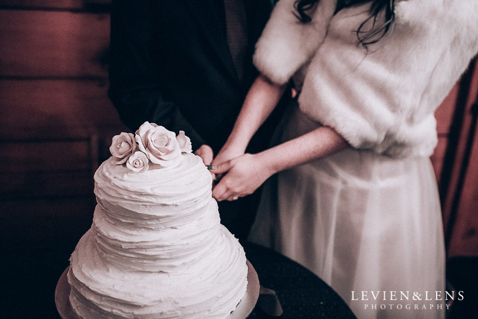 cake cutting - reception Highwic historic house-museum winter wedding {Auckland NZ lifestyle weddings photographer}