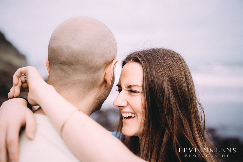 bride laughing - Muriwai Beach couples-engagement photo shoot {Auckland wedding photographer}