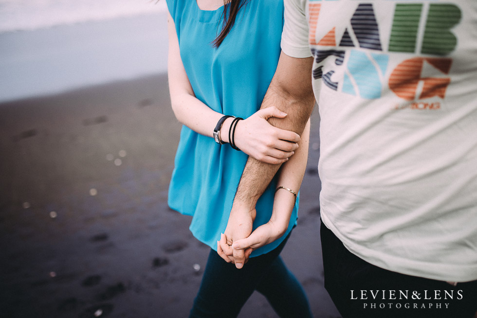 holding hands - Muriwai Beach couples-engagement photo shoot {Auckland wedding photographer}